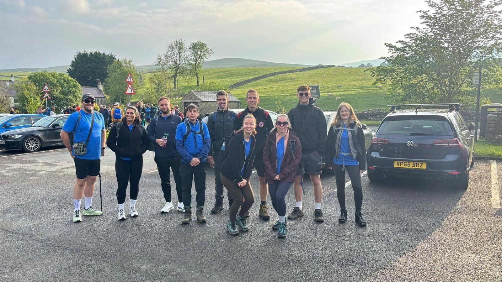 a happy team at the start of a hike