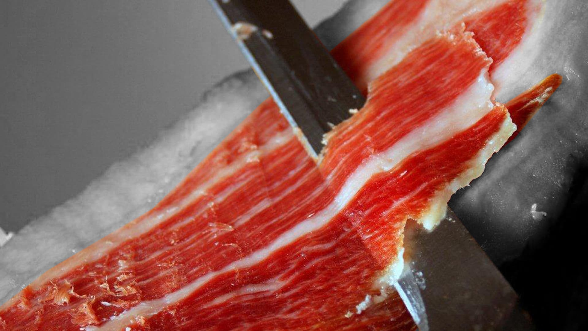 knife cutting bacon 