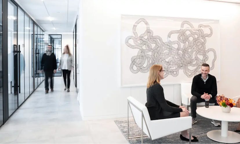 People talking in a reception area of a office