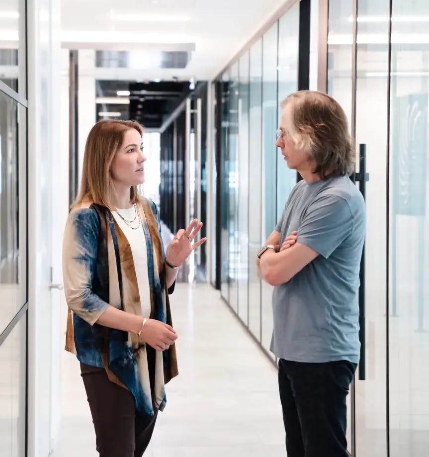 Two people talking in the Atlas Venture office